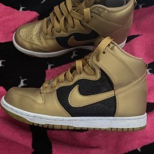 Women’s black and gold hi tops